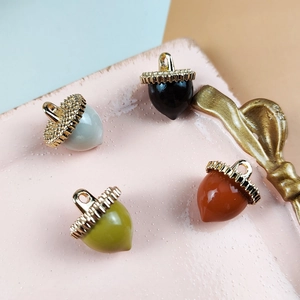 DIY acorn charms in four colors with gold metal caps for necklaces and earrings