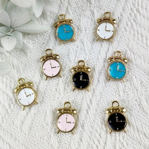 DIY colorful alarm clock enamel charms in gold metal for jewelry making on white knit