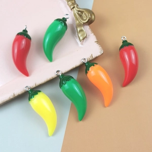 DIY colorful resin pepper charms in red green yellow and orange with silver metal loops