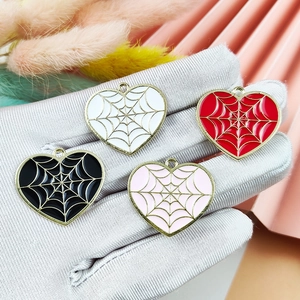 Halloween heart spider web charms in black, white, red, and pink colors for jewelry making