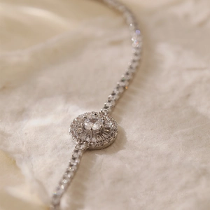 Macro detail of silver floral halo bracelet with sparkling cubic zirconia inlay