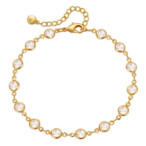 Bracelet de cheville doré élégant avec zircons ronds et fermoir ajustable sur blanc