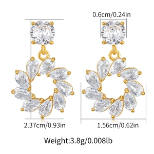 Macro shot of 18K gold plated flower earrings showing dimensions 2.37cm by 1.56cm