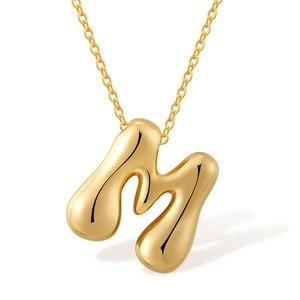 Polished gold bubble letter M pendant necklace with elegant mirror finish for women