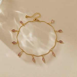 Detail of 18K gold plated anklet with pink marquise stones and lobster clasp closure