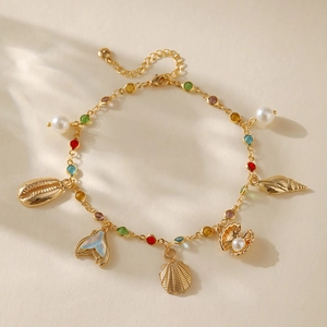 Bohemian gold plated anklet with colorful gems, sea shells, and iridescent mermaid tail