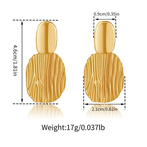 Detailed view of gold earrings featuring vertical ripples with size measurements