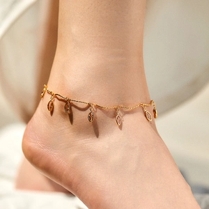 Gold plated anklet featuring marquise cut brown gemstone charms for beach fashion