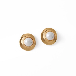 Detailed view of classic pearl earrings with 18K gold plated finish and elegant design