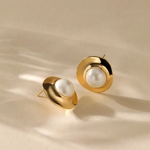 Vintage style oversized pearl earrings with irregular gold base plated in 18K gold