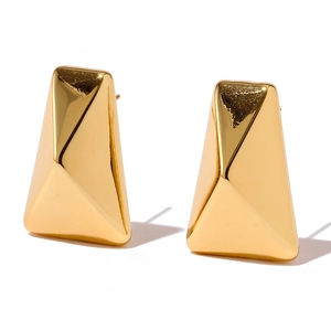 Close-up of polished 18K gold plated earrings with a 3D geometric irregular facet design