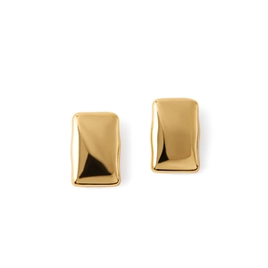 Macro shot of gold-plated rectangular earrings featuring polished wavy geometric edges