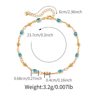 Detail view of gold anklet with blue glass gemstones and measurement annotations
