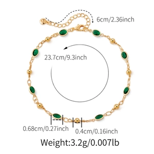 Detailed view of gold anklet featuring green teardrop glass stones and beads with sizing