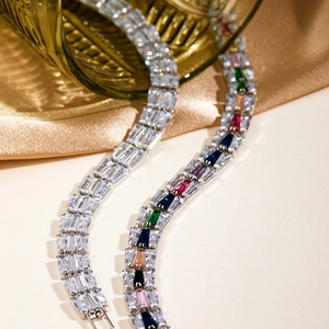 Detail of baguette cut cubic zirconia tennis bracelet with sparkling multi-colored gemstones