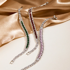 Exquisite sparkling tennis bracelets with emerald, ruby and pink stones in silver setting