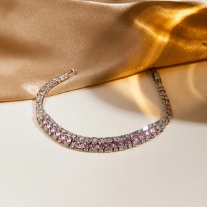 Detail of luxury tennis bracelet with pink cubic zirconia and silver-plated finish