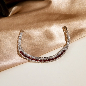 Close-up of double-row bracelet with marquise-cut red gems and white zircons