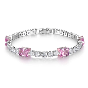 Detail of tennis bracelet featuring pink square gems and round white crystals in silver
