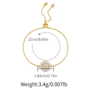 Detail view showing dimensions of a gold sunburst bracelet with white zircon inlay