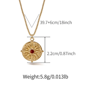 Detail view of golden sunflower pendant with red bead showing exact size measurements