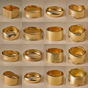 Collection of 16 gold-plated cuff bracelets in varied textures like hammered and smooth finish
