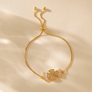 Detailed view of adjustable gold-plated heart bracelet with zircon butterfly centerpiece