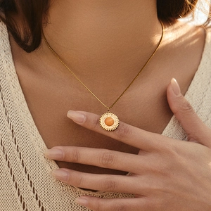 Chic gold stainless steel necklace with sun flower pendant and orange gemstone inlay