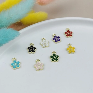 Eight colorful flower charms in golden alloy frames for DIY jewelry making and crafts