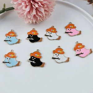 Detailed view of DIY ghost alloy charms with witch hats and brooms for jewelry making