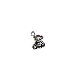 Antique silver teddy bear charm with detailed fur texture and bow for DIY jewelry making