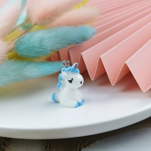 Detailed view of a cute 3D resin unicorn charm with blue mane for DIY jewelry making