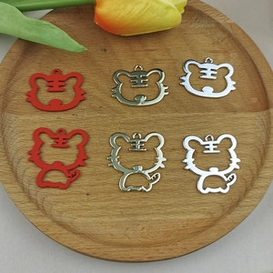 Hollow tiger pendants for DIY jewelry making in gold, silver, and red matte finish