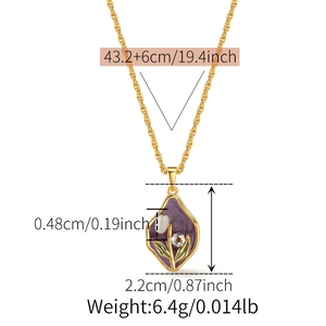 Detail view of gold twisted chain necklace with purple enamel floral shell pendant