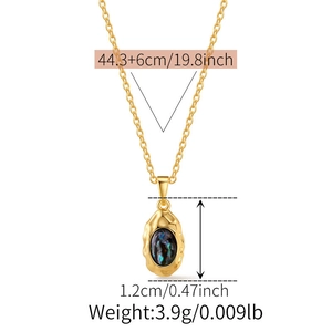 Detailed view of irregular gold shell pendant necklace with product dimensions and weight