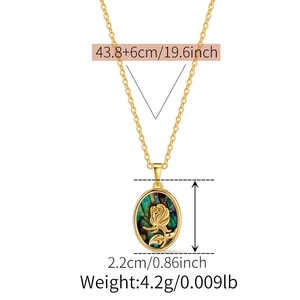Detail of gold necklace featuring oval shell pendant with rose flower relief engraving