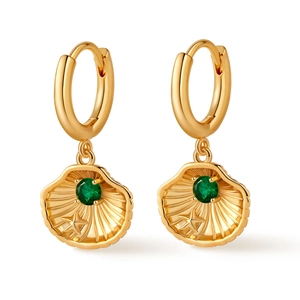 Detailed close-up of gold seashell hoop earrings with green zircon and star engraving
