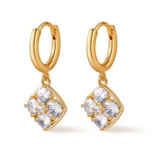 Detailed macro view of gold hoop earrings featuring sparkling diamond clusters
