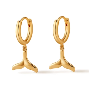 Detailed view of gold plated fish tail hoop earrings with a mirror polished finish