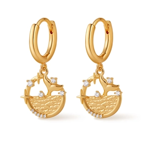 Close-up of gold-plated hoop earrings featuring hollow dolphin tail and wave patterns