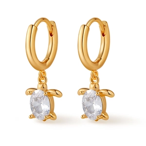 Detailed close-up of gold-plated sea turtle hoop earrings with oval zircon crystal stones