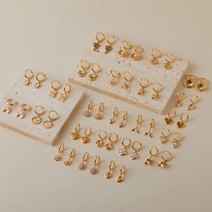 Gold-plated ocean collection hoop earrings with sea star, shell and zircon charms