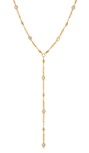 Macro shot of 18K gold plated Y-lariat necklace with bead chains and cubic zirconia stones