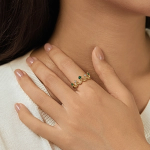 Elegant 18K gold crown ring with emerald green stones and white cubic zirconia