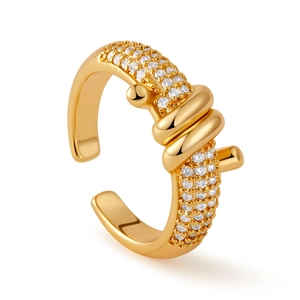 Detail shot of golden 18K starfish design ring with pavé zircon stones and layered curves