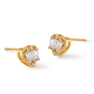 Detail of heart-shaped gold studs featuring baguette-cut crystals and beaded edges