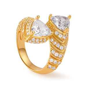 Close-up of golden starfish ring with sparkling cubic zirconia and micro-pave details