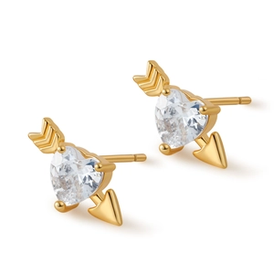Macro shot of Cupid's arrow stud earrings featuring heart shaped zircon in gold plating