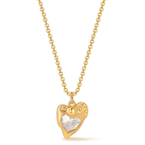 Detail of a vintage heart pendant necklace with irregular gold metal and clear zircon stone