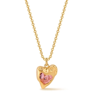 Macro detail of gold-plated lava texture heart pendant with pink zircon gemstone inlay